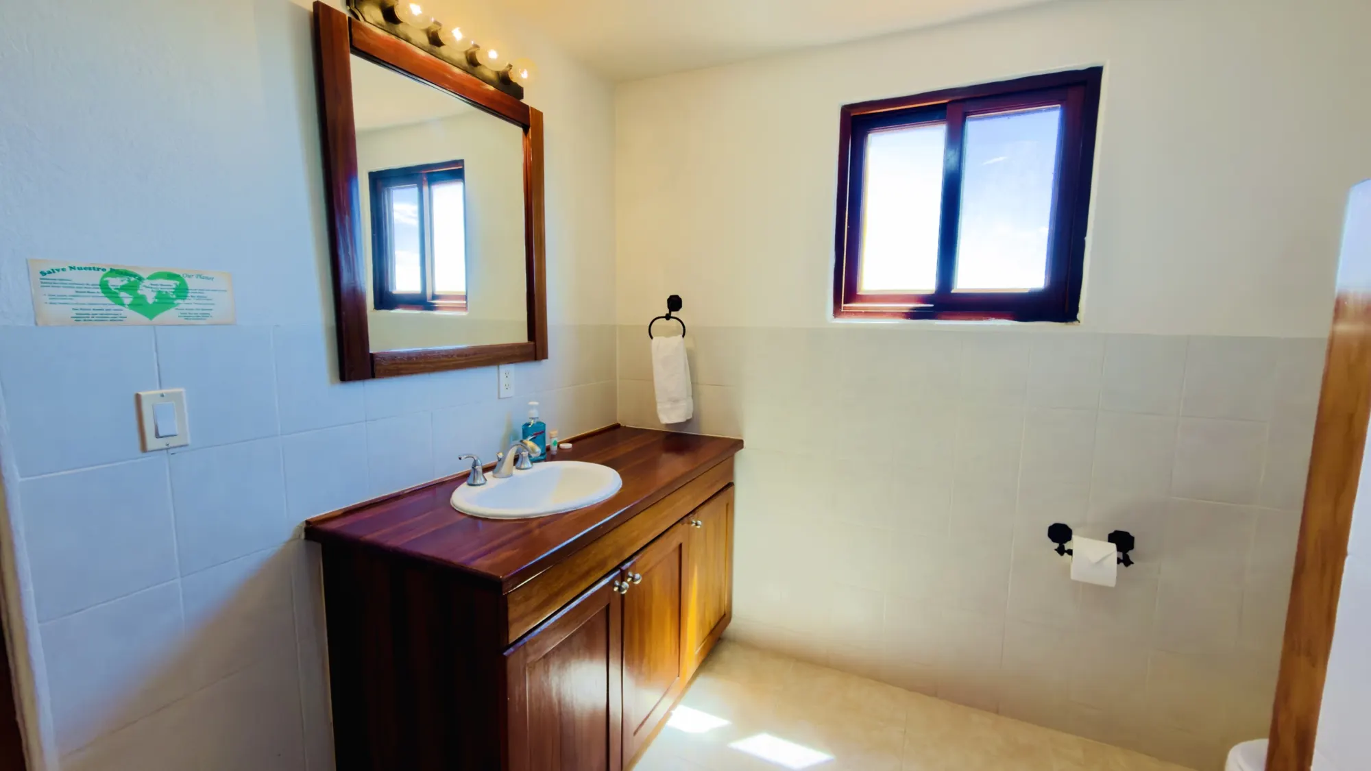 Villa bathroom with a wood vanity