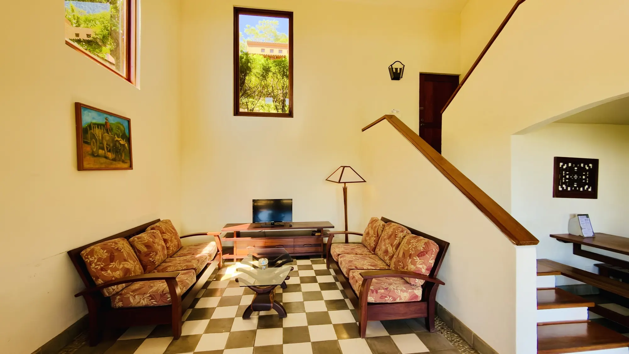 Living room with sofas and the staircase to the upper floor